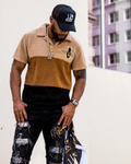 Model wearing the 1K Bee Chenille three tone streetwear polo with black jeans and a 1k Kicks hat
